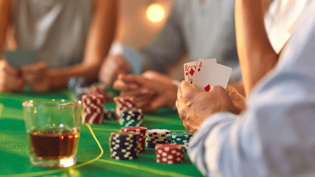 Holding playing cards and casino chips