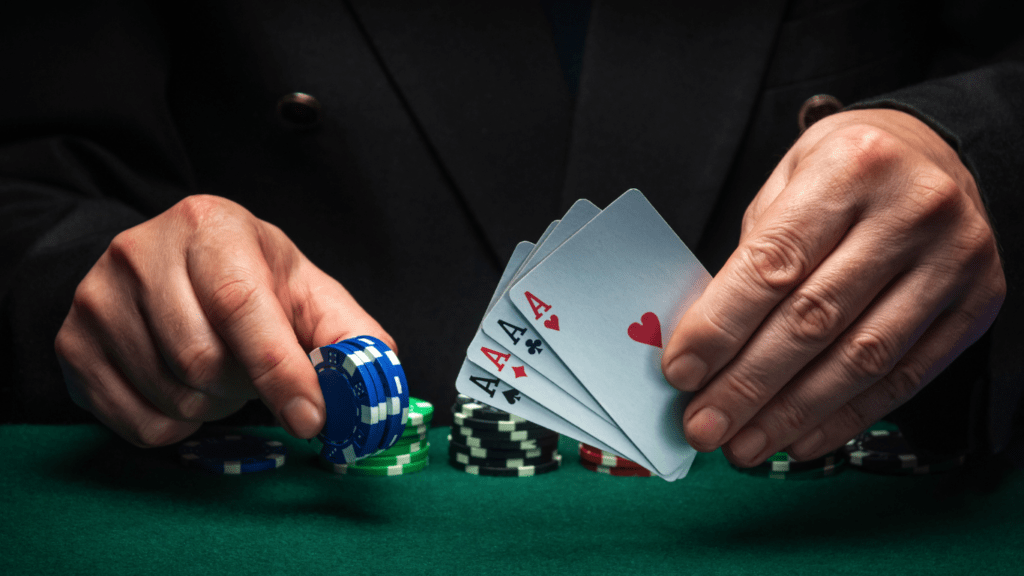 Holding casino chips and playing cards 